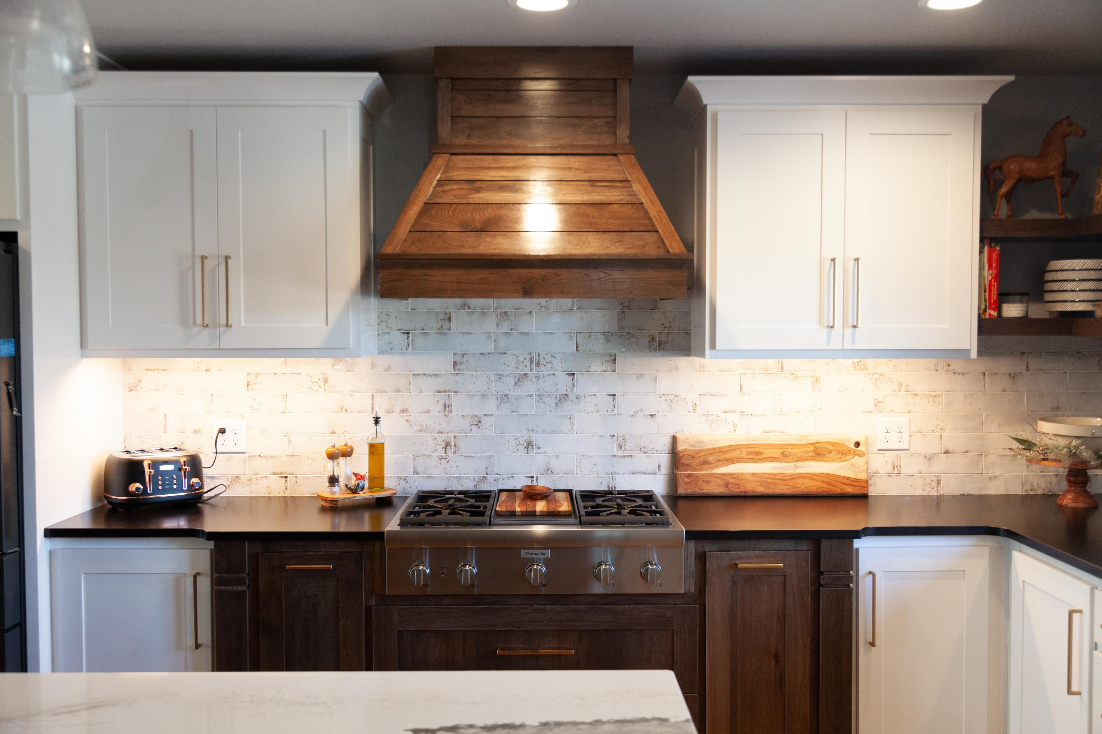 Modern kitchen with custom range hood